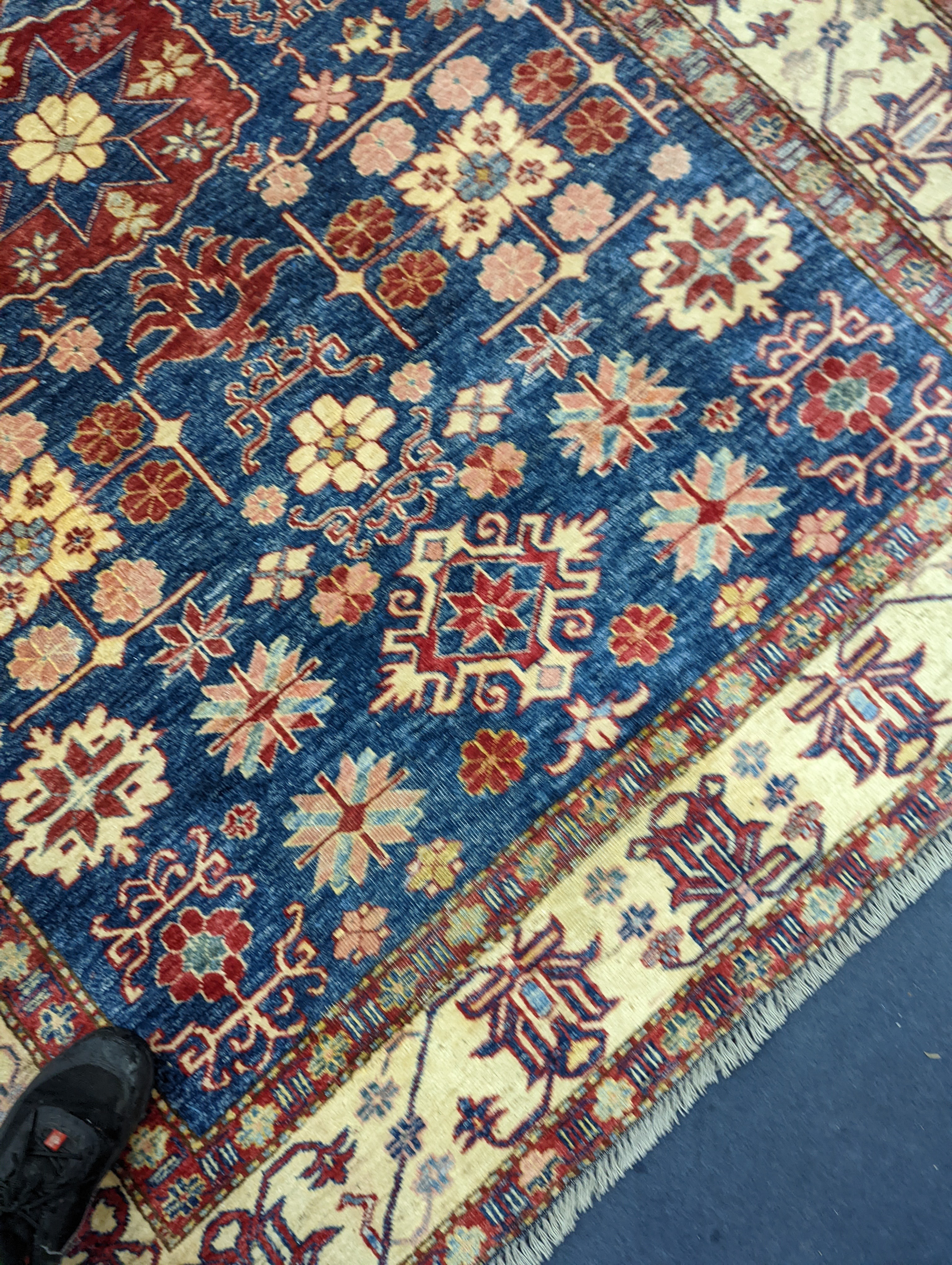 A Kazak blue ground carpet, 242 x 186cm